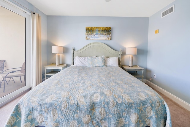 carpeted bedroom with baseboards, visible vents, and access to outside