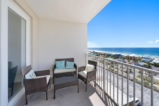 balcony featuring a water view