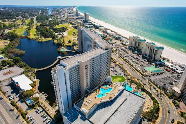 birds eye view of property featuring a water view and a city view