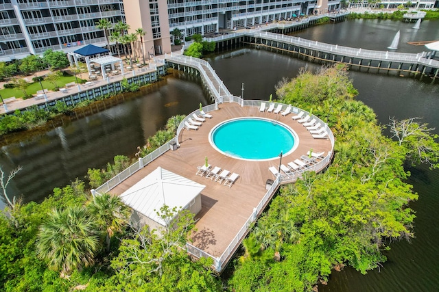 view of swimming pool with a water view and a gazebo