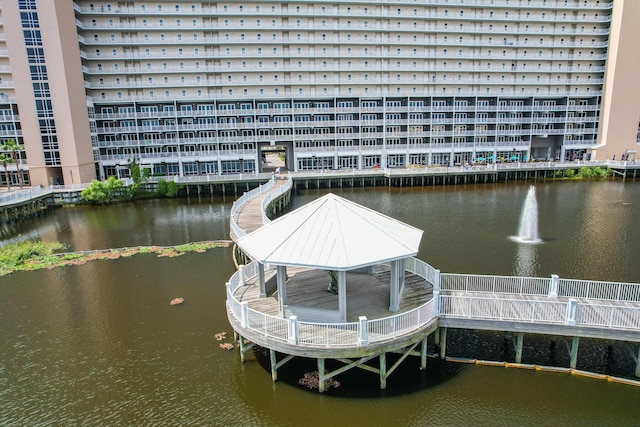 view of dock featuring a water view and a gazebo