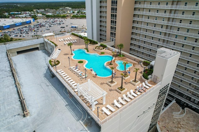 community pool with a patio area