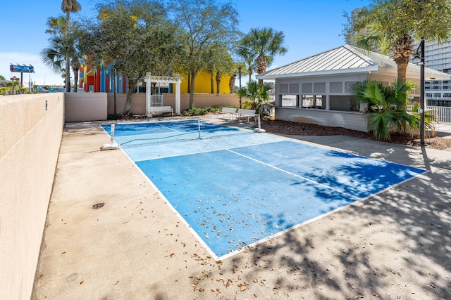 view of swimming pool with a tennis court, fence, and a pergola