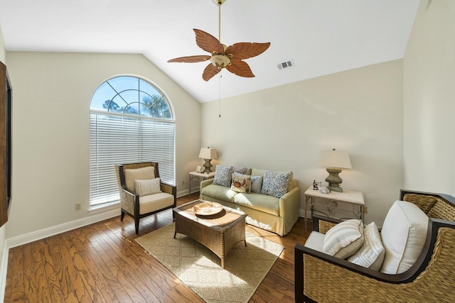 living area featuring lofted ceiling, baseboards, visible vents, and dark wood-type flooring