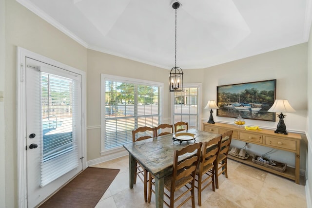 dining space with an inviting chandelier, ornamental molding, and light tile patterned flooring