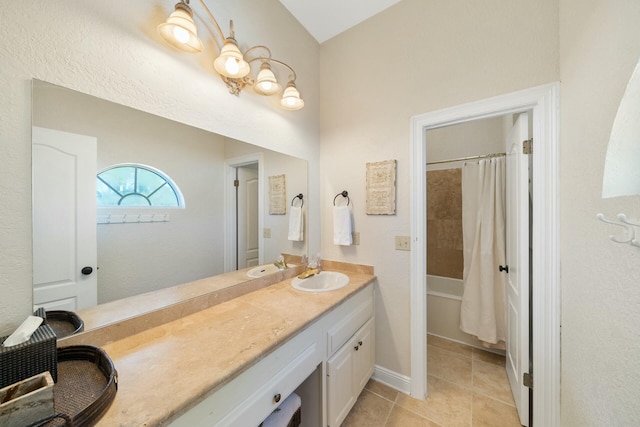 bathroom featuring tile patterned flooring, vanity, and shower / bathtub combination with curtain