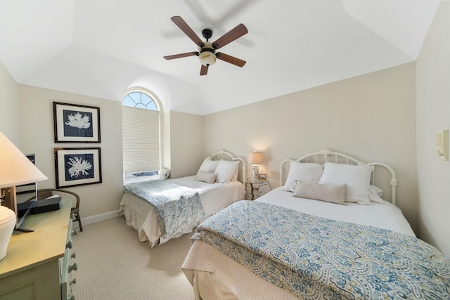 bedroom with a ceiling fan, light carpet, vaulted ceiling, and baseboards