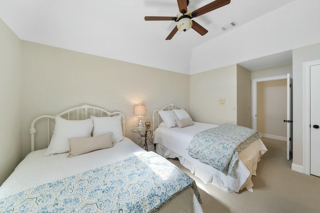 bedroom with lofted ceiling, visible vents, light carpet, ceiling fan, and baseboards