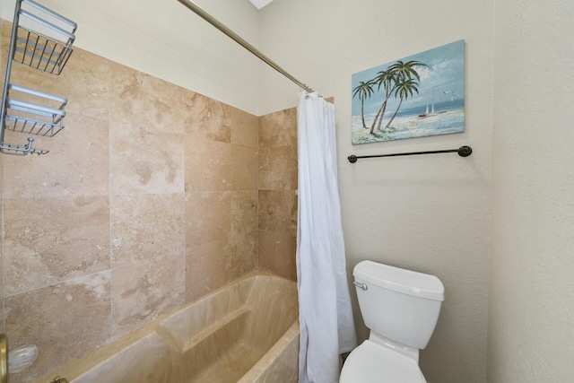 bathroom featuring shower / bathtub combination with curtain and toilet