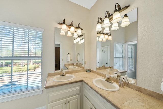 full bath featuring a sink and double vanity