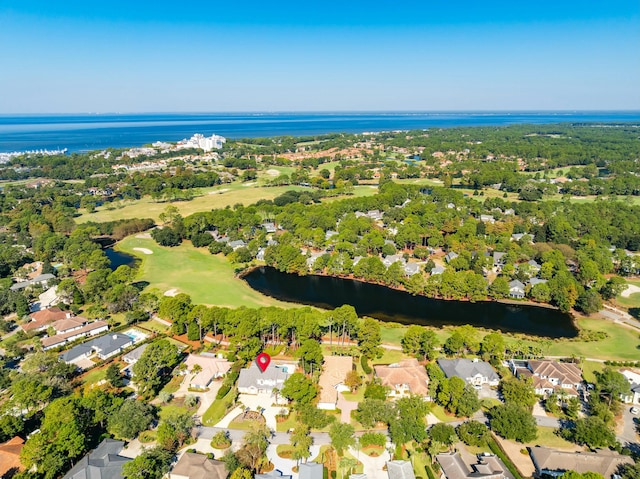 drone / aerial view featuring a water view, a residential view, and golf course view