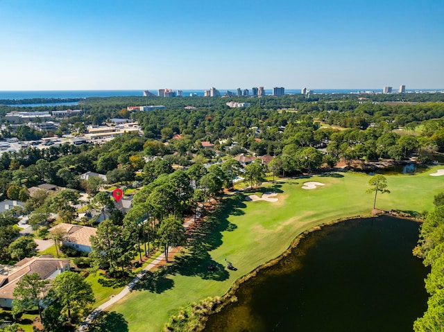 birds eye view of property with view of golf course, a water view, and a city view