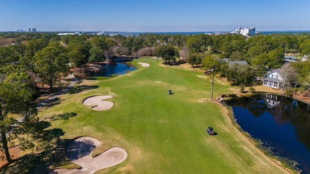 drone / aerial view featuring a water view and golf course view