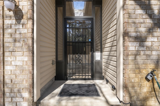 view of exterior entry with stone siding