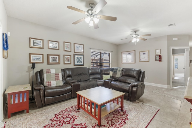 living room featuring baseboards, visible vents, ceiling fan, and tile patterned floors