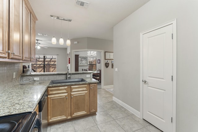 kitchen featuring visible vents, decorative backsplash, stove, a sink, and a peninsula