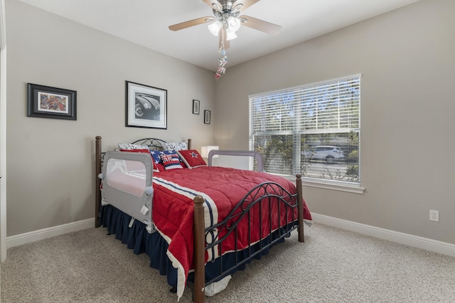 bedroom with carpet floors, ceiling fan, and baseboards