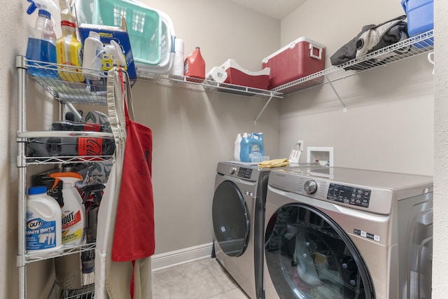 washroom with laundry area, tile patterned flooring, and independent washer and dryer