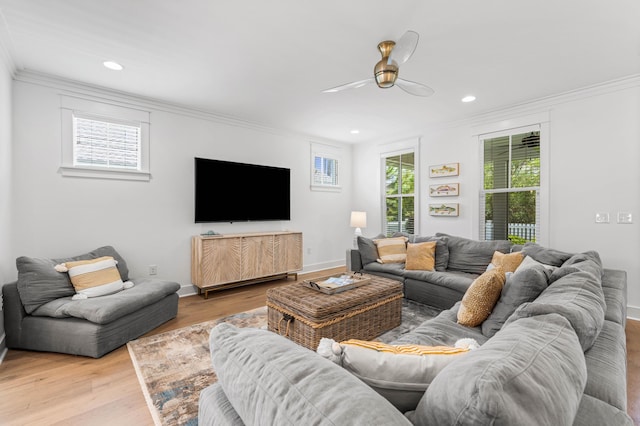 living room with baseboards, light wood-style floors, recessed lighting, and crown molding