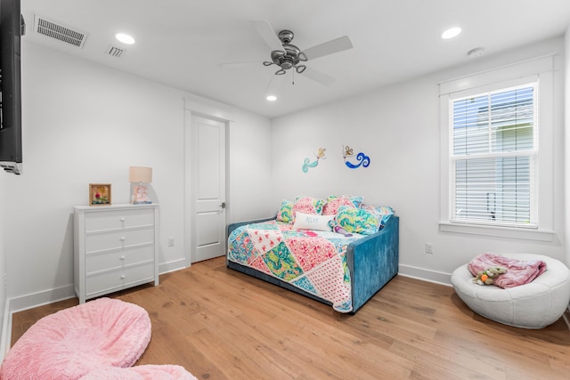 bedroom with recessed lighting, visible vents, baseboards, and wood finished floors