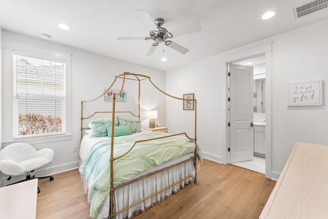 bedroom featuring light wood finished floors, visible vents, and recessed lighting