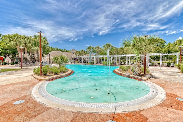 view of swimming pool with a pergola