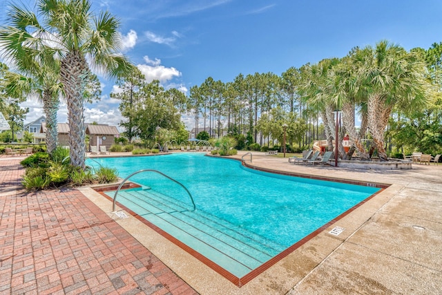 community pool featuring a patio area