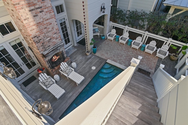 wooden deck with french doors and a patio