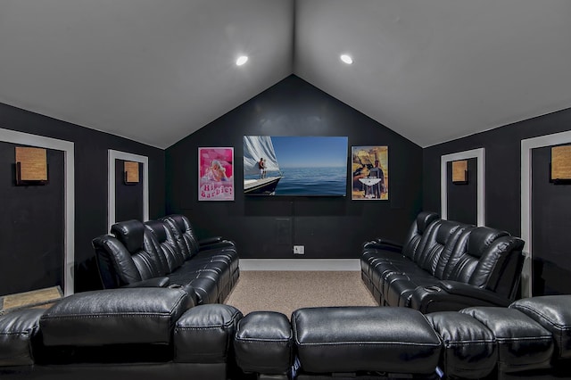 cinema with lofted ceiling and carpet flooring