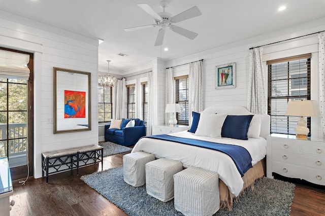 bedroom featuring multiple windows, wood finished floors, and visible vents