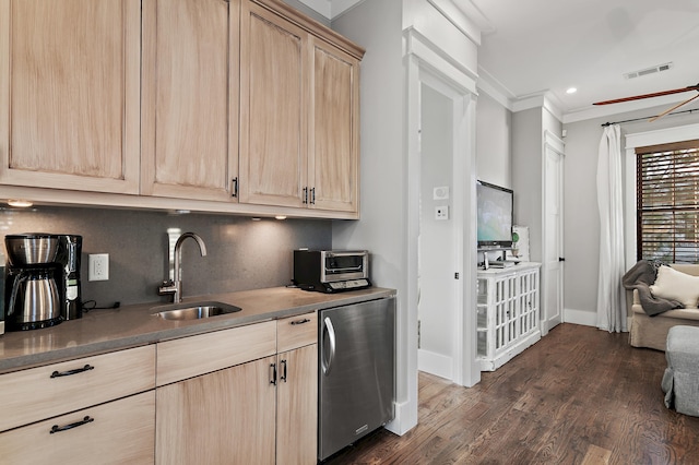 kitchen featuring a sink, visible vents, fridge, backsplash, and light brown cabinetry