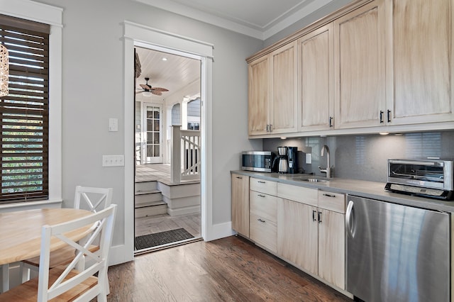 kitchen featuring refrigerator, dark wood finished floors, stainless steel microwave, light brown cabinets, and a sink