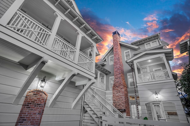 view of side of property with stairs