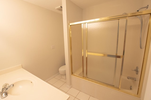 1700 Dellmont Cv, Niceville, FL 32578 - bathroom featuring tile patterned flooring, toilet, enclosed tub / shower combo, and vanity
