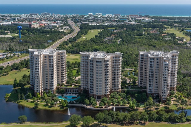 drone / aerial view featuring a water view and a city view