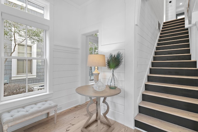 stairway with wood finished floors