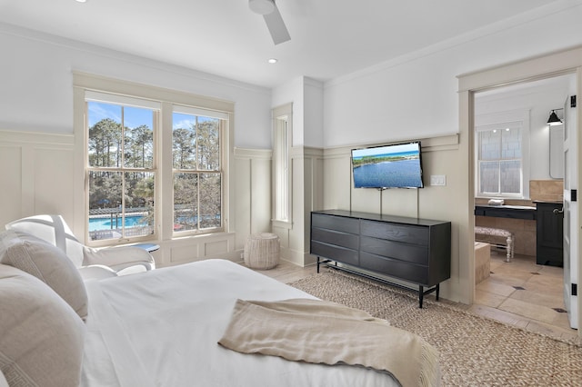 bedroom featuring crown molding, recessed lighting, a decorative wall, and ceiling fan