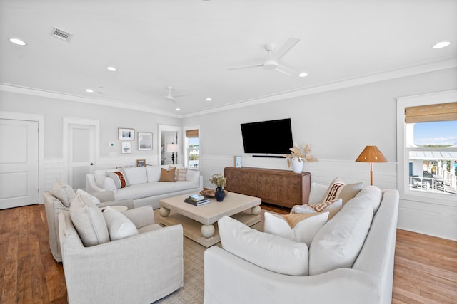 living room featuring light wood-style floors, visible vents, a ceiling fan, and recessed lighting