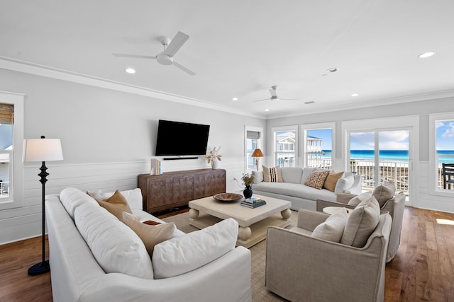 living room with ceiling fan, recessed lighting, crown molding, and wood finished floors