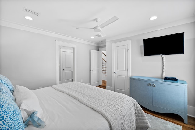 bedroom featuring ceiling fan, visible vents, dark wood-type flooring, and recessed lighting