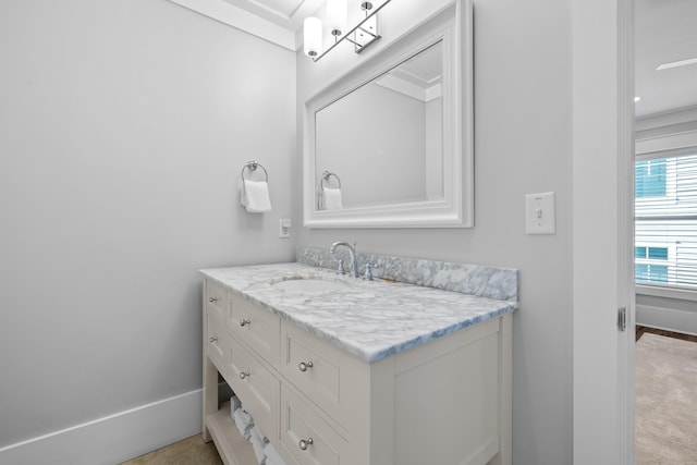 bathroom with vanity and baseboards