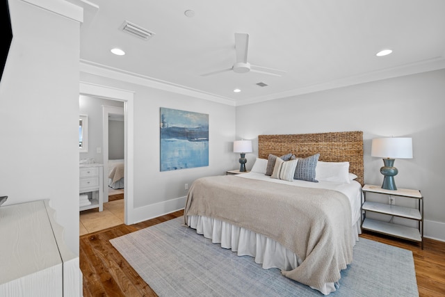 bedroom featuring baseboards, visible vents, wood finished floors, and recessed lighting