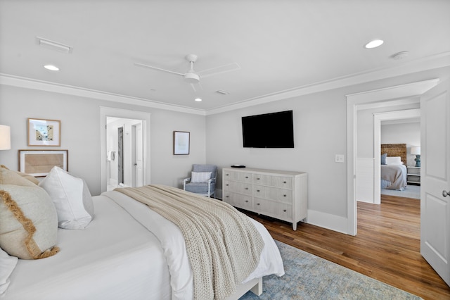 bedroom featuring ornamental molding, wood finished floors, visible vents, and recessed lighting