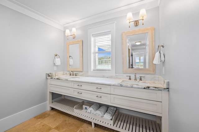 full bath featuring crown molding, a sink, baseboards, and double vanity