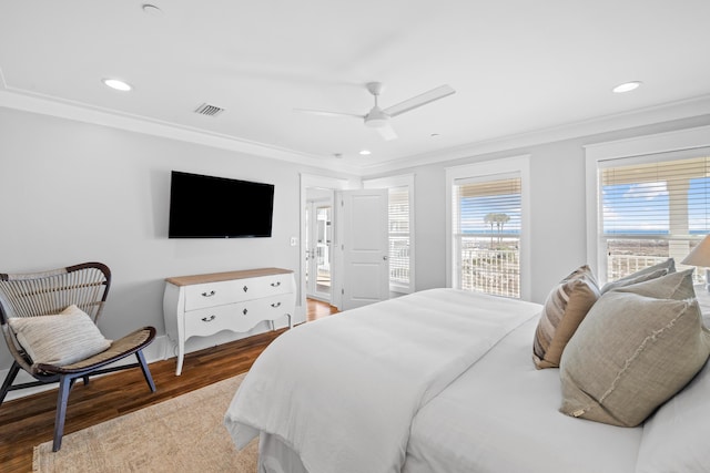 bedroom featuring recessed lighting, visible vents, ornamental molding, a ceiling fan, and wood finished floors