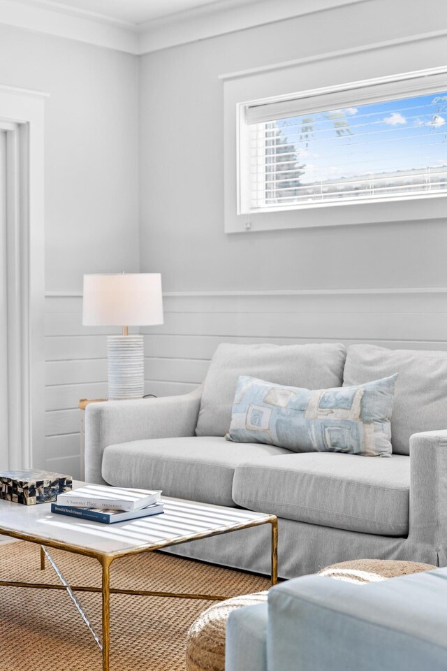 living room featuring crown molding