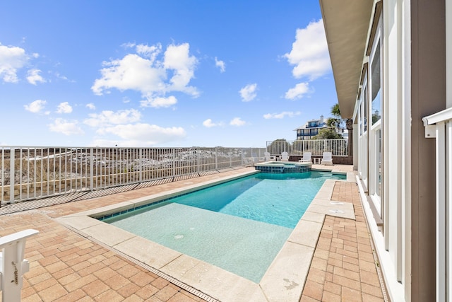 view of swimming pool with a patio, a fenced backyard, and a pool with connected hot tub