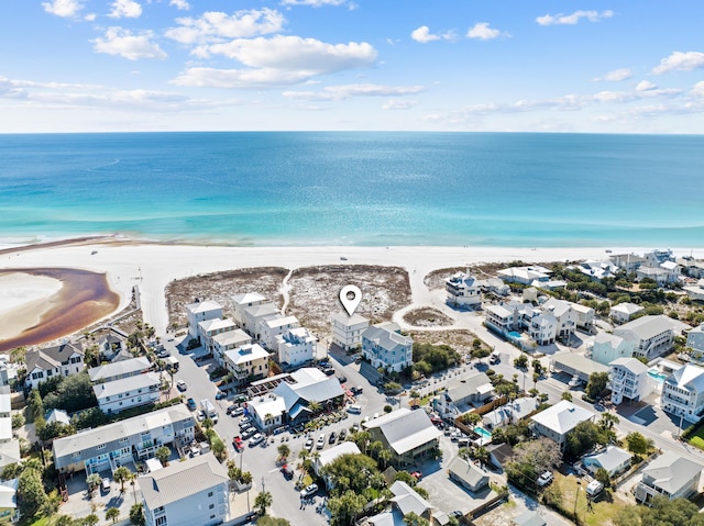 aerial view with a water view and a beach view