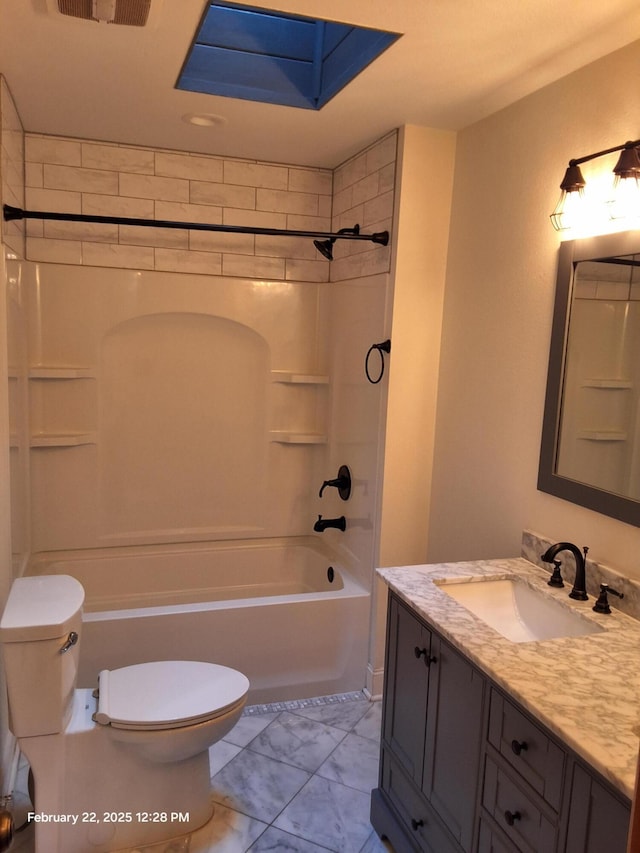 bathroom featuring marble finish floor, shower / bath combination, vanity, and toilet