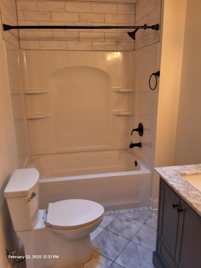 bathroom featuring bathtub / shower combination, vanity, and toilet